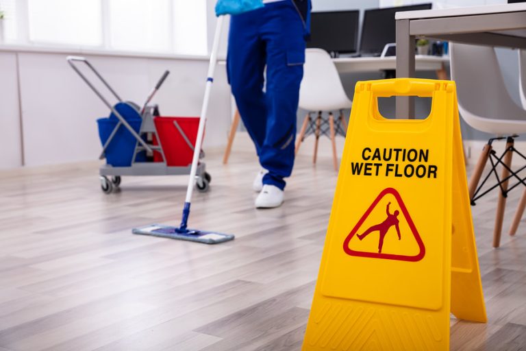 man mopping the floor